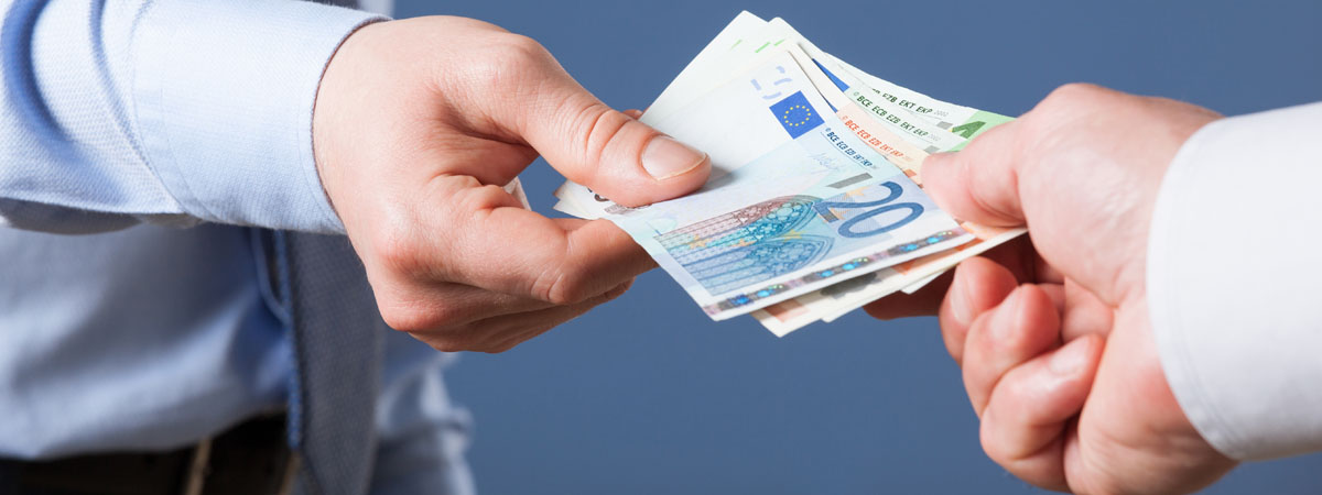 Businessman's hands exchanging euro on blue background