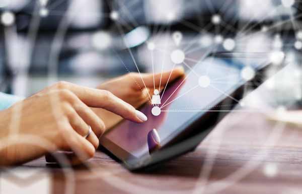 Female hands with digital tablet. Young woman working remotely at home. Concept of networking or remote work. Global business network. Online courses.